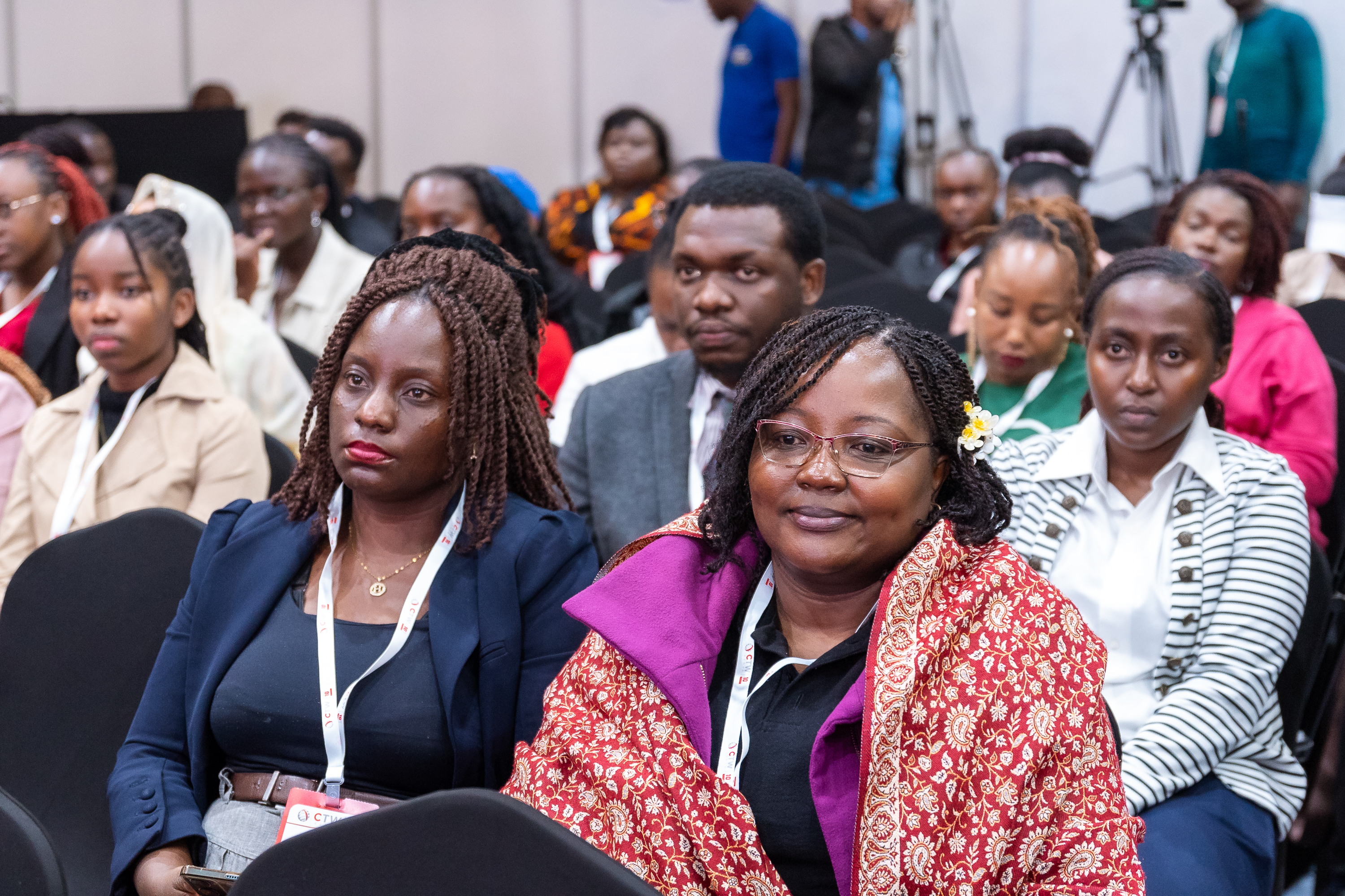 Women listening attentively in the audience