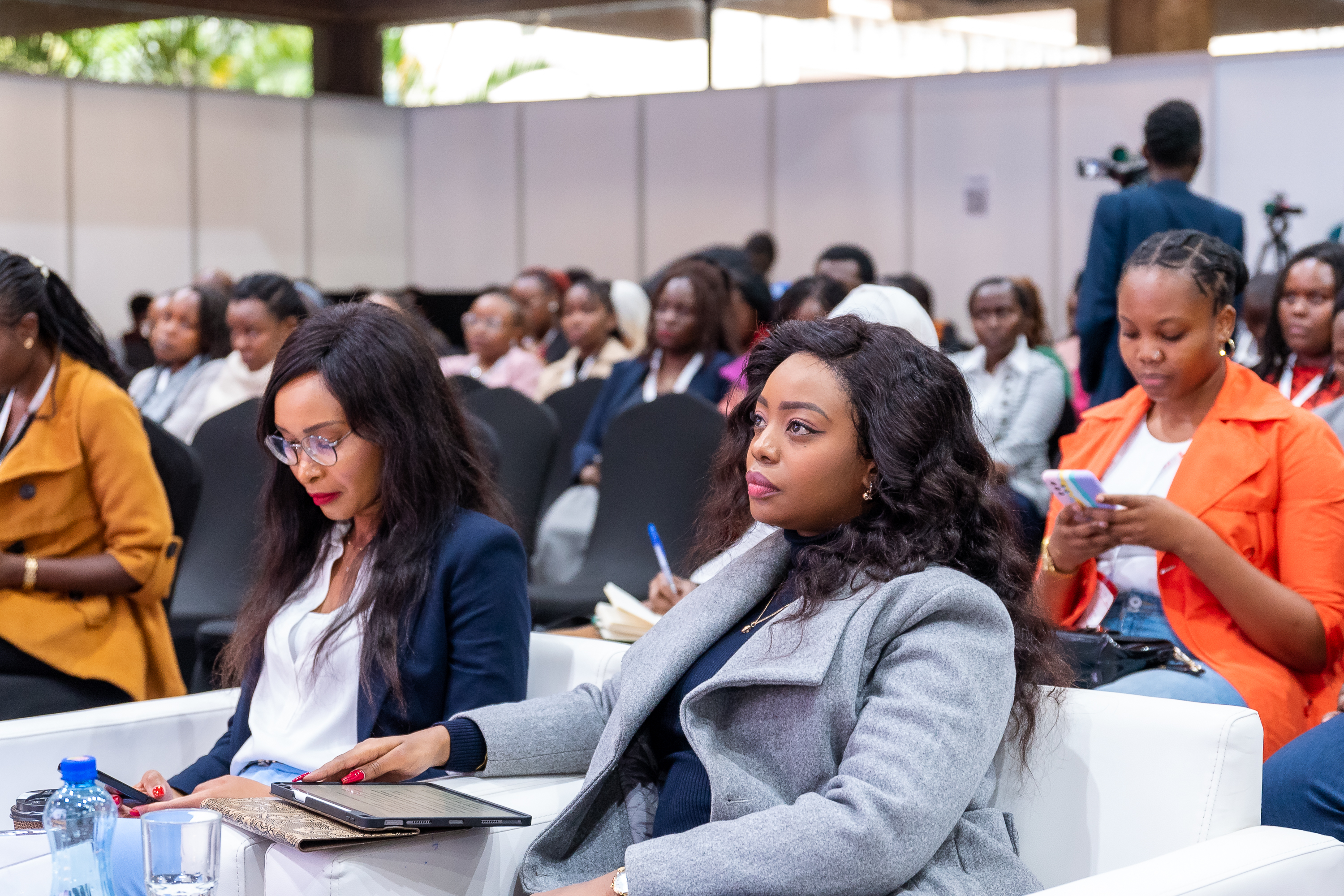Attendees listening in the audience