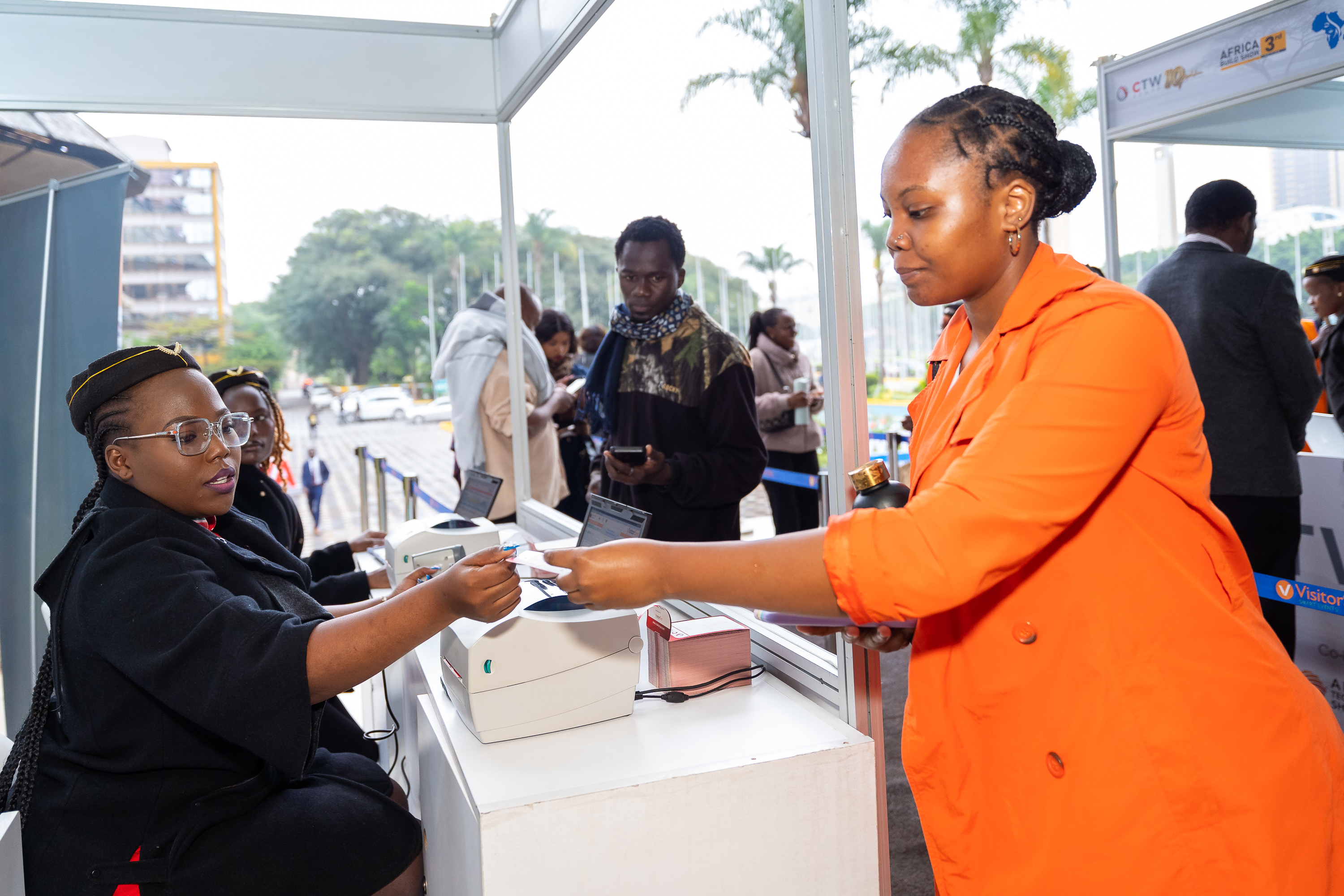 An attendee collecting her badge at registration
