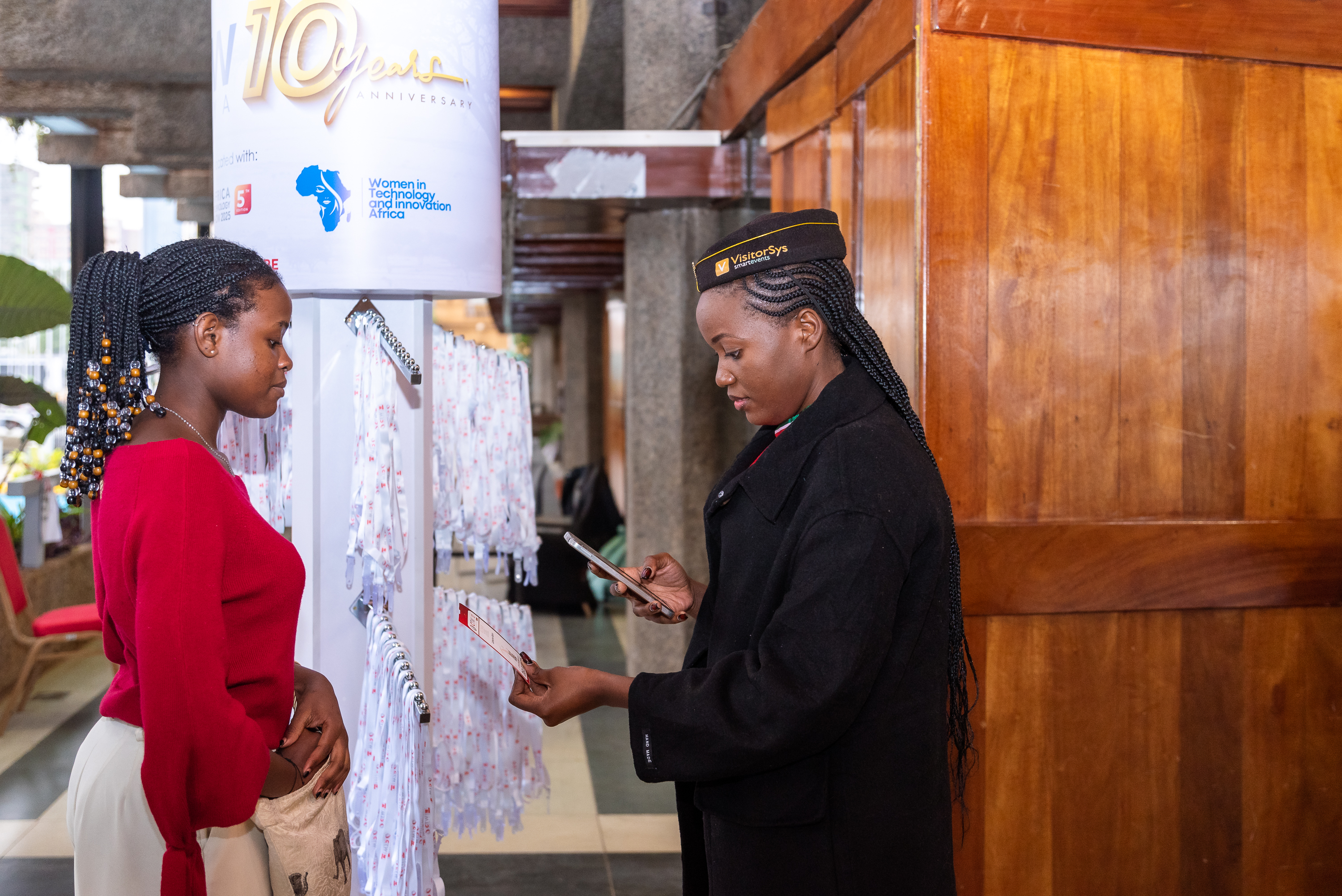 An attendee being helped at the registration area