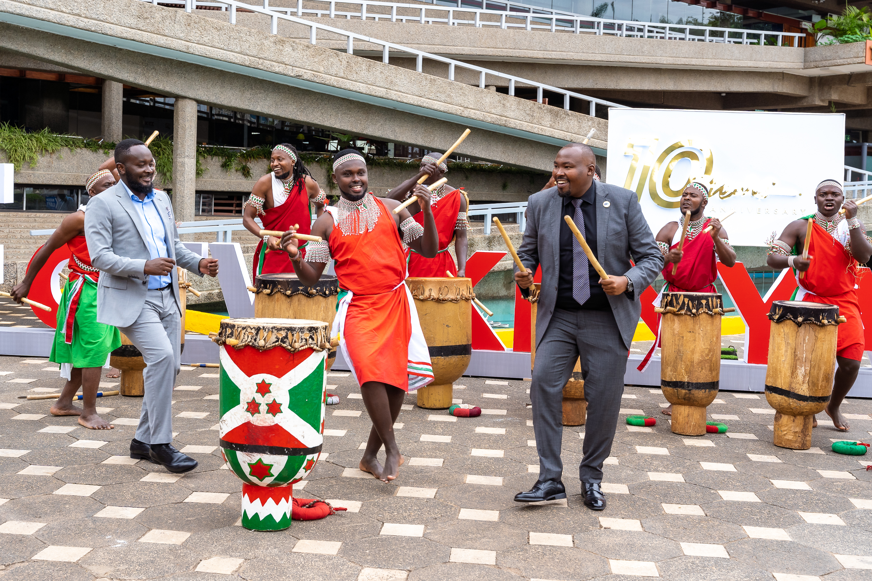 Guests dancing with traditional drummers outside KICC at the 2025 summit