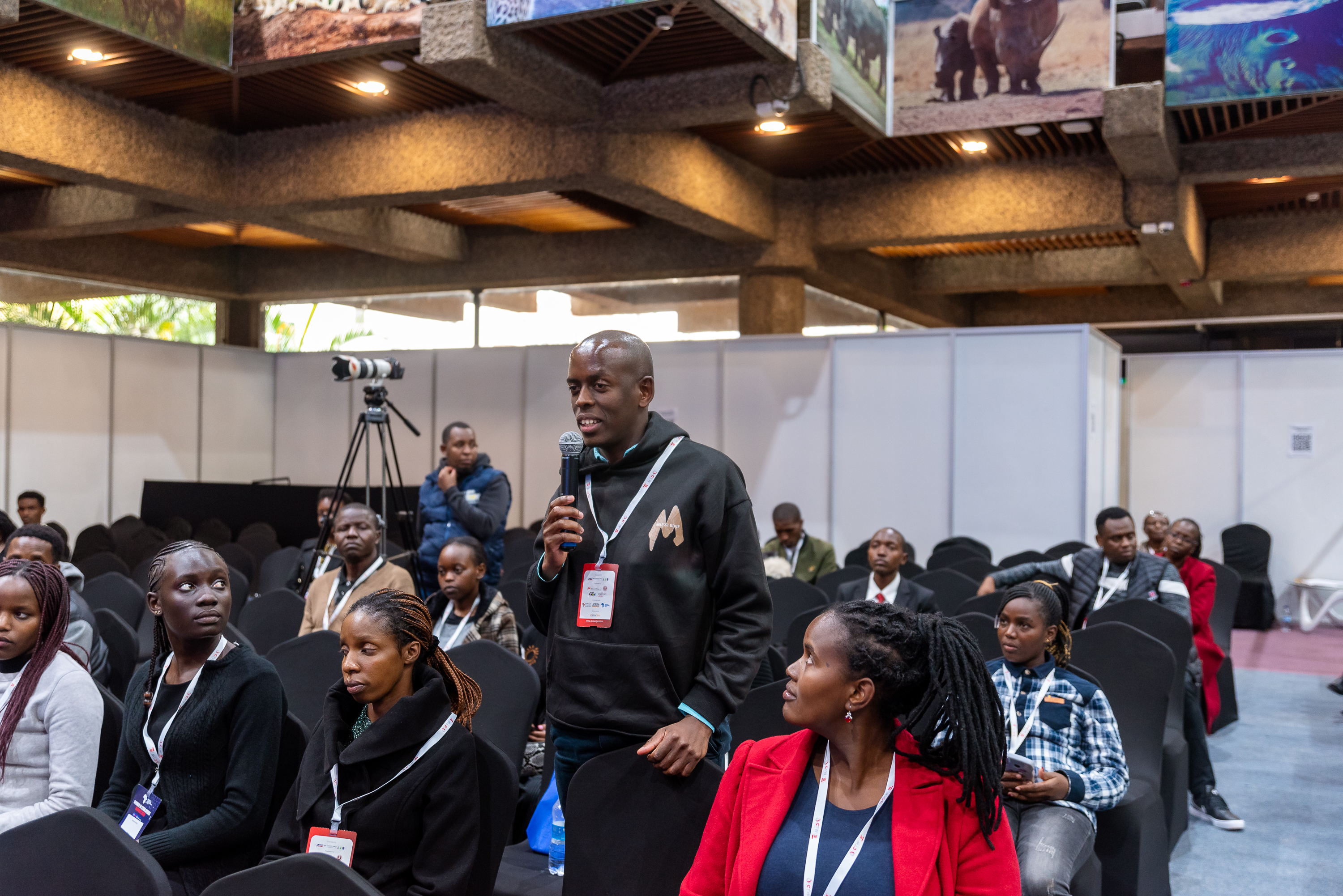 An attendee asking a question from the audience