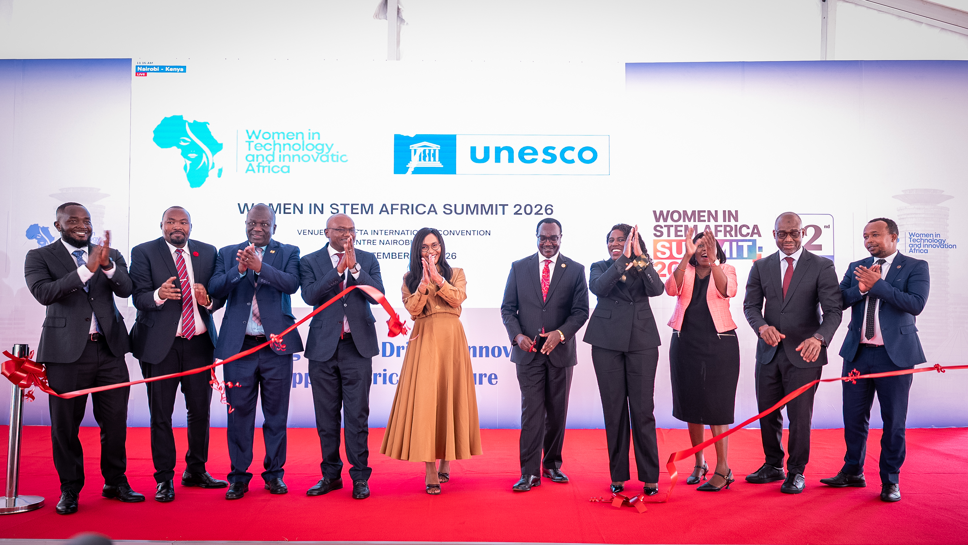 Guests applauding after cutting the ribbon to open the summit