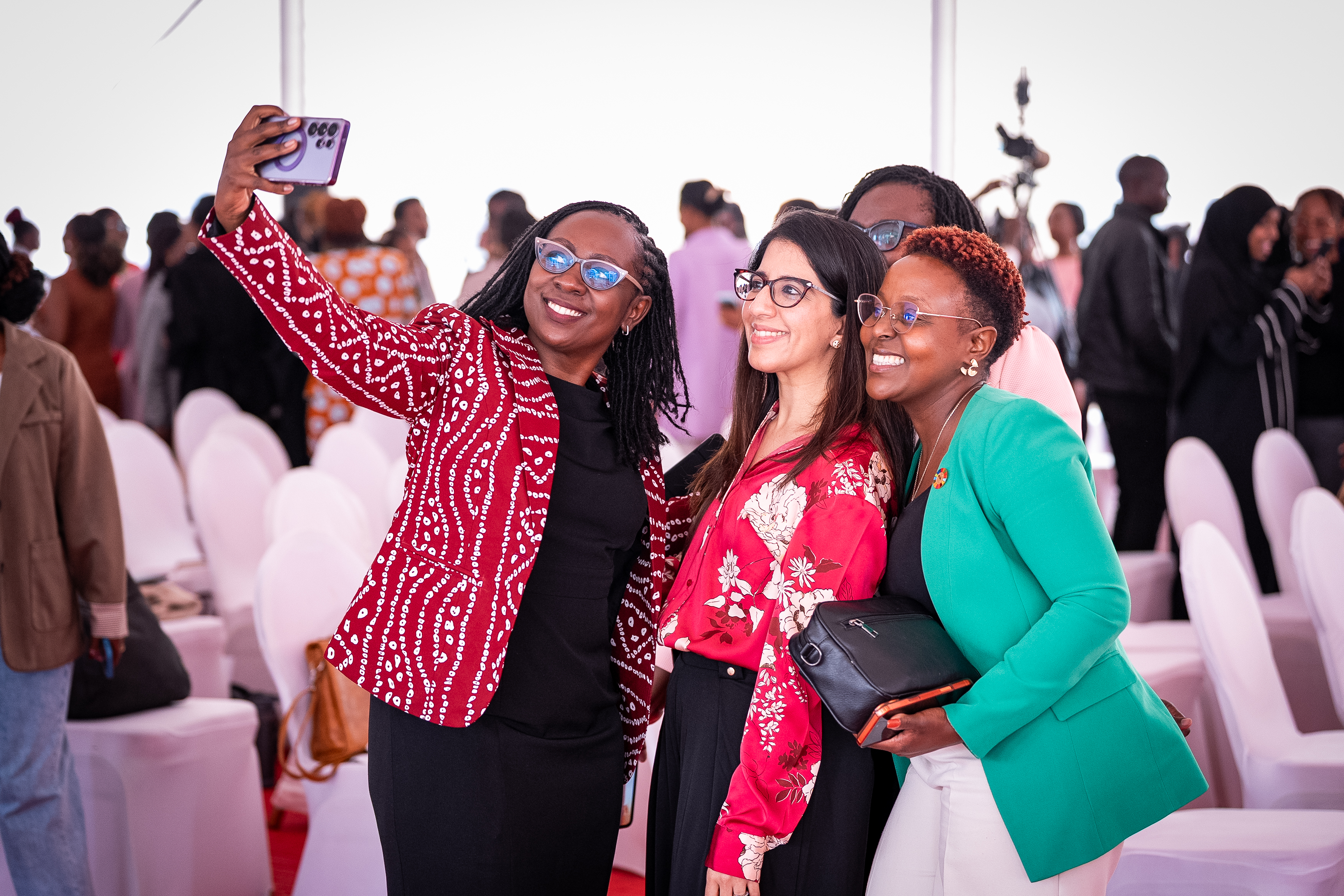 Three attendees taking a selfie together