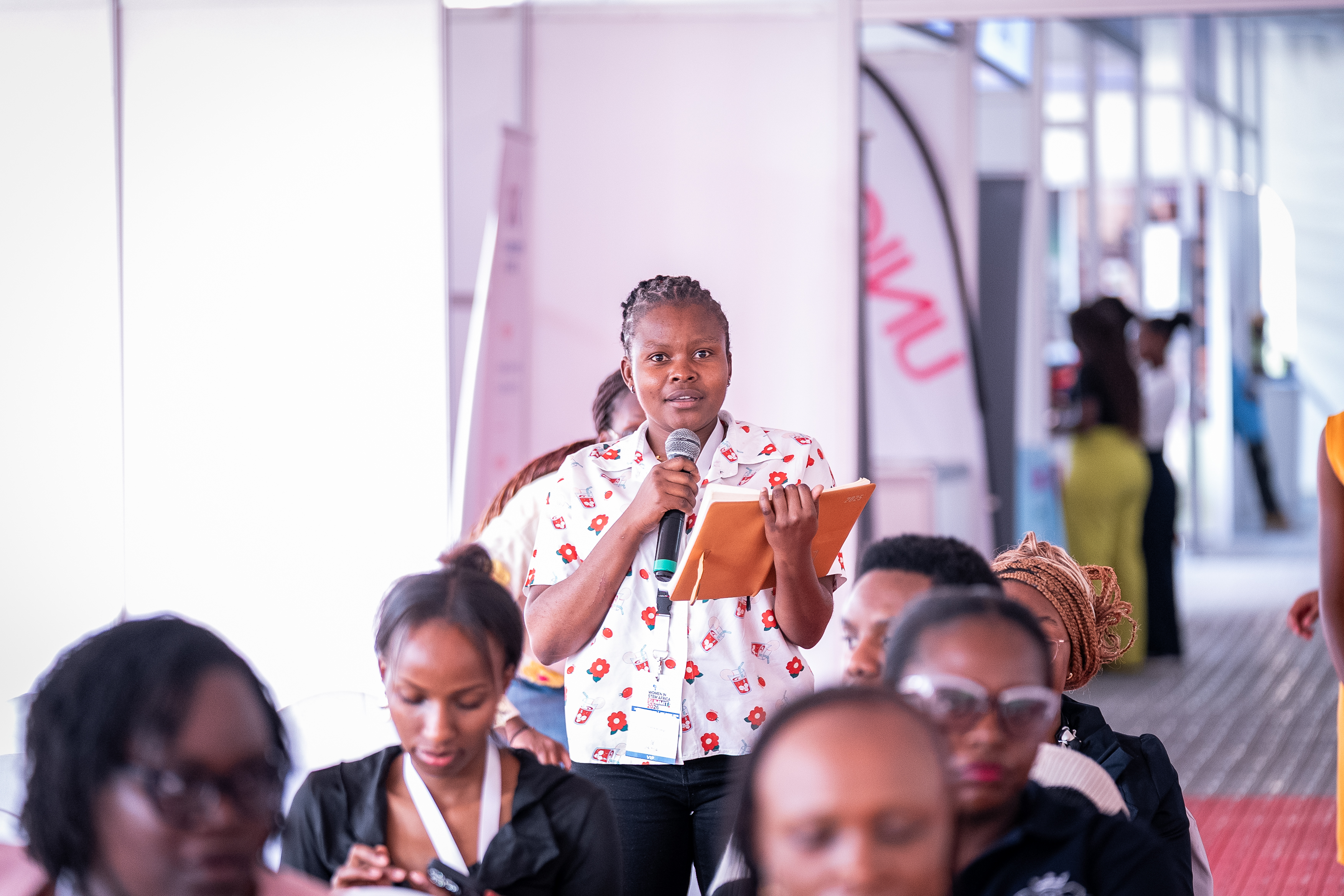 An attendee asking a question from the audience