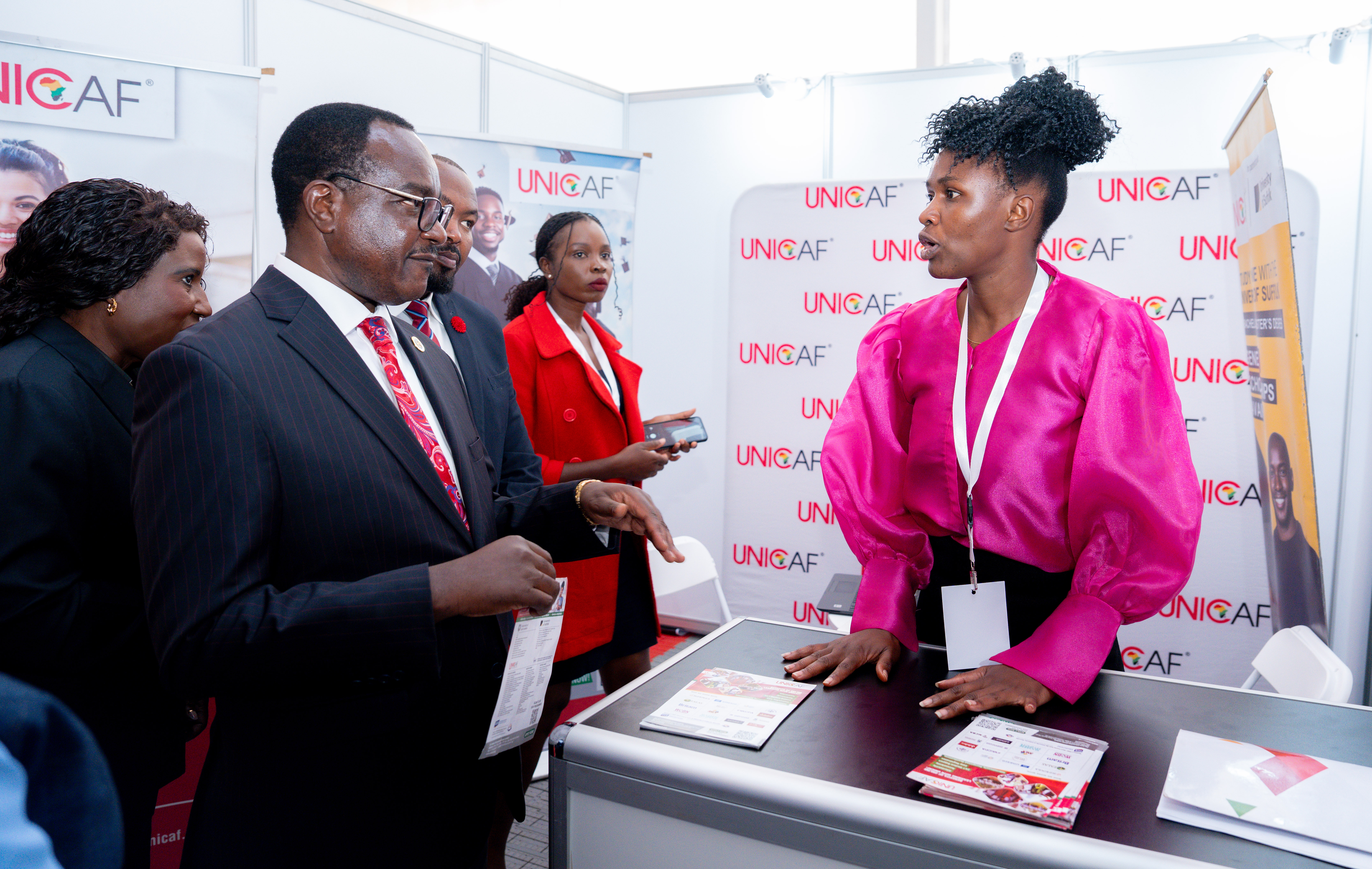 A guest visiting the UNICAF exhibition stand